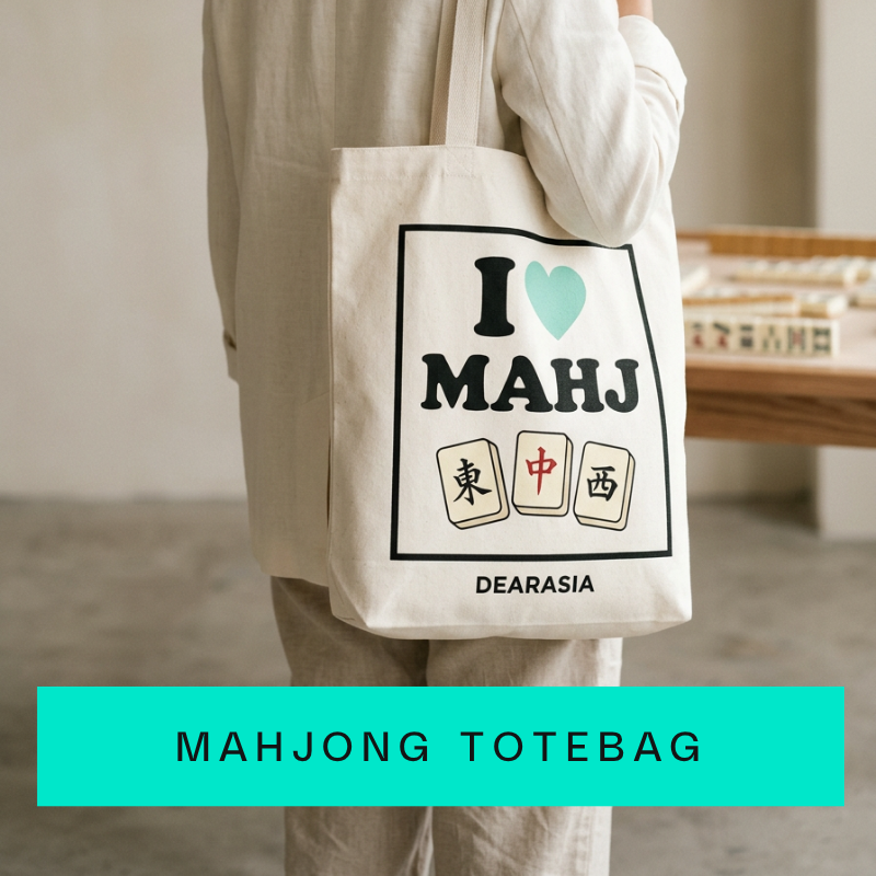 a person carrying a mahjong totebag by dear asia london